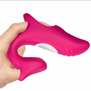 Hand holding a pink silicone finger toothbrush.