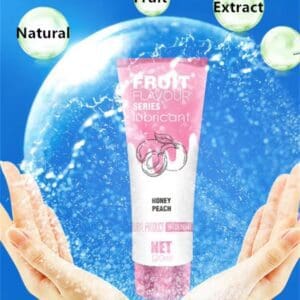 Pink skincare tube with water splash and hands, highlighting natural and plant extracts.